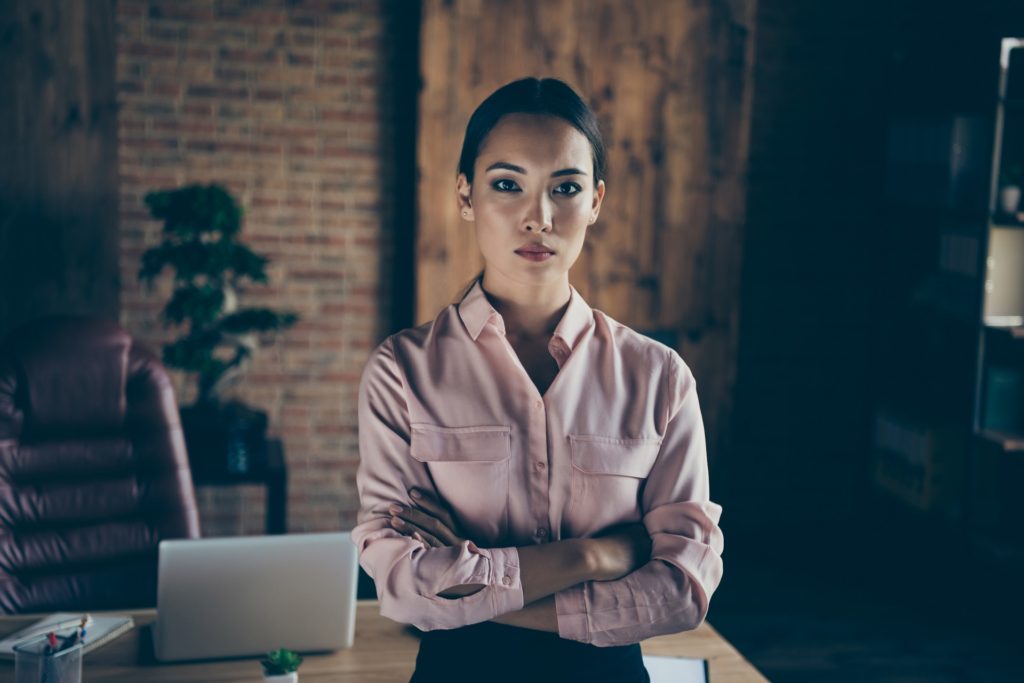 Portrait of her she nice-looking attractive elegant bossy stylish trendy content lady shark expert folded arms at modern industrial loft interior style work place station indoors